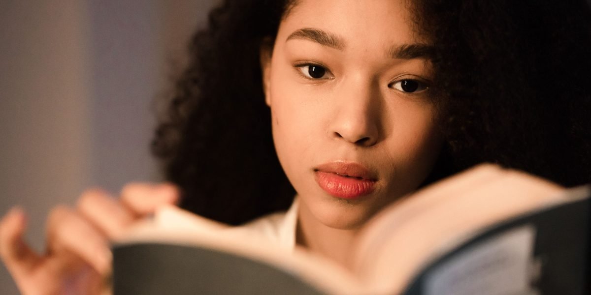 A person focused on reading or learning, representing the dedication required for continuous education in the fast-evolving field of AI.