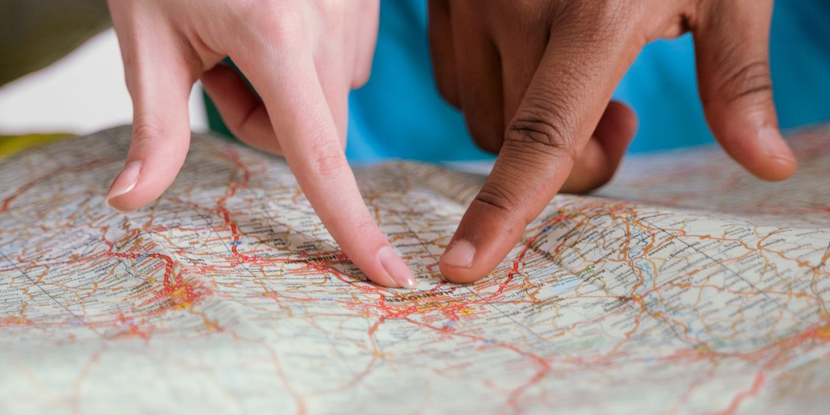 A project manager reviews a roadmap, symbolizing the strategic planning required to implement AI projects from pilot to production.
