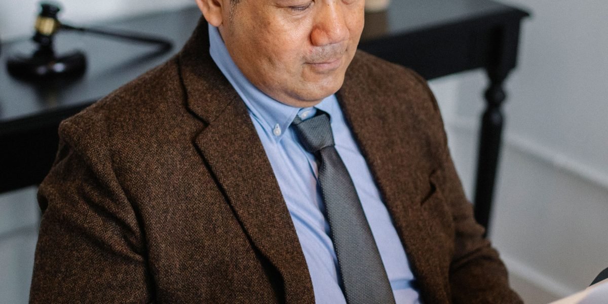 A professional confidently reviewing documents, illustrating the efficiency and reduced burden offered by AI in legal work.