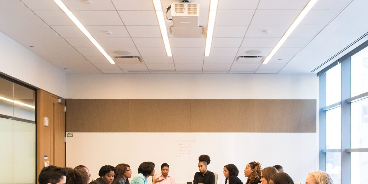 A team collaborating in an office setting, reflecting the widespread adoption of AI tools in modern development.
