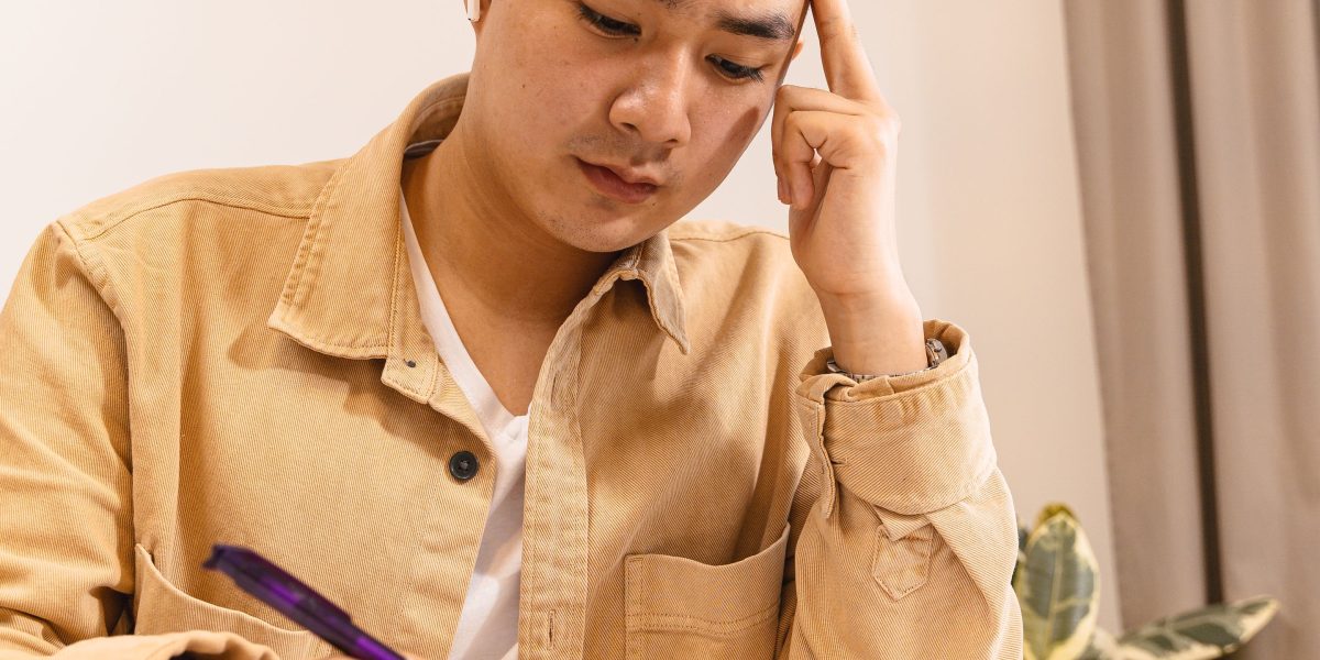 An individual deeply engaged in problem-solving, illustrating the application of AIMA's theoretical concepts to practical challenges.