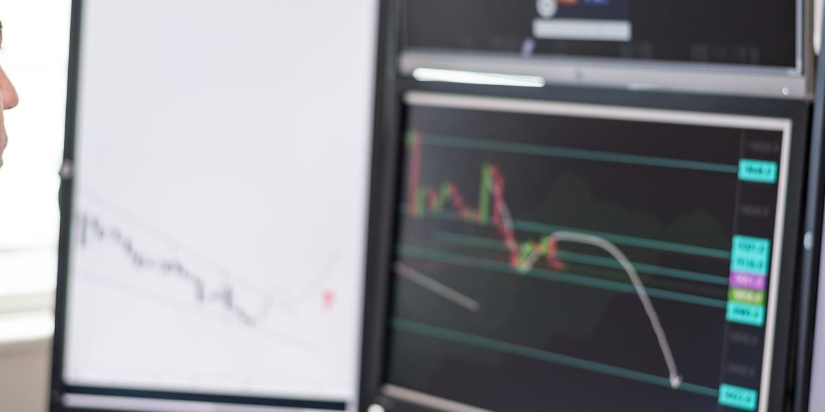 A person carefully reviewing financial documents, representing investment decision-making in a fast-paced market.