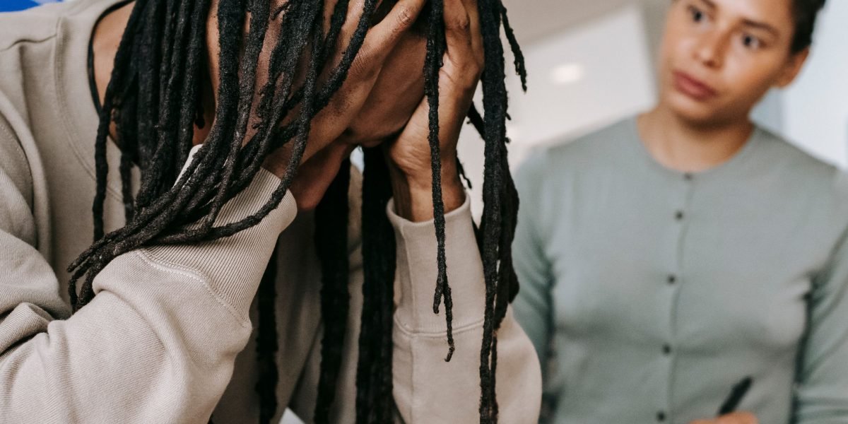 An individual deeply focused on solving a complex problem, representing the process of debugging and finding solutions.