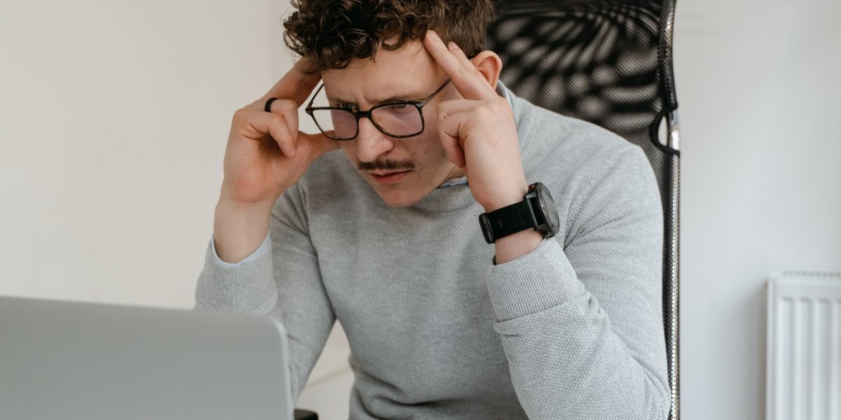 An engineer focused on thoughtfully solving a complex programming challenge.