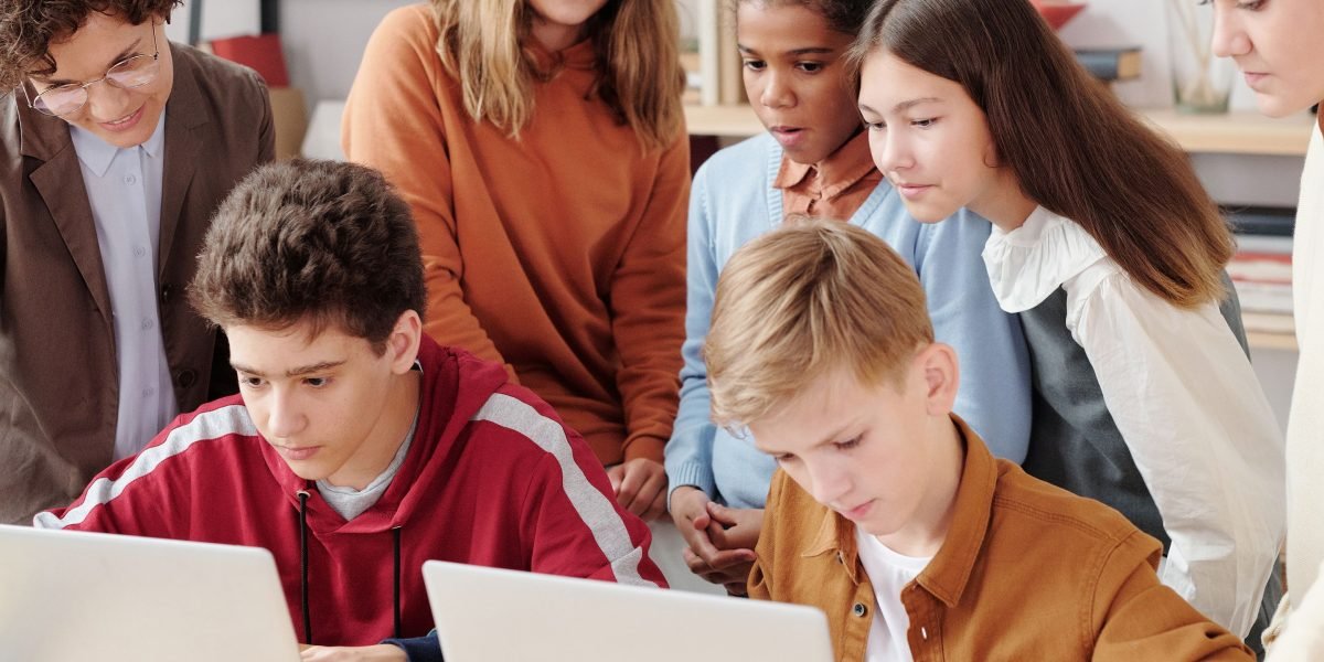 Children from diverse backgrounds collaborate on a learning activity, emphasizing equitable access to education.