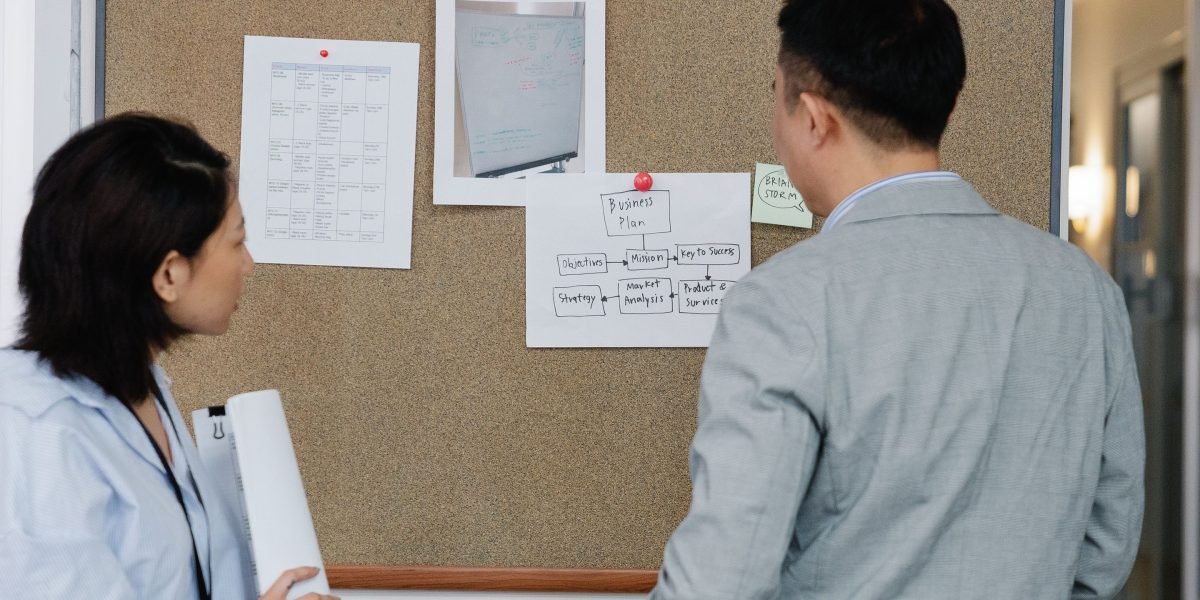 Professionals engaging in a discussion, illustrating the strategic planning and funding efforts behind a growing tech company.