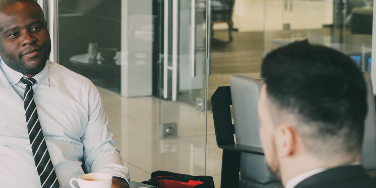 A confident professional participating actively in a business meeting, symbolizing career advancement and impact.