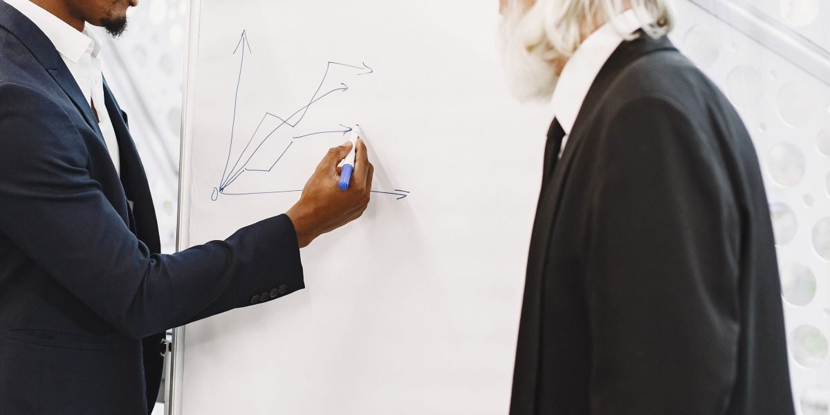 A project manager confidently making a decision while using a whiteboard, symbolizing the vendor evaluation process.