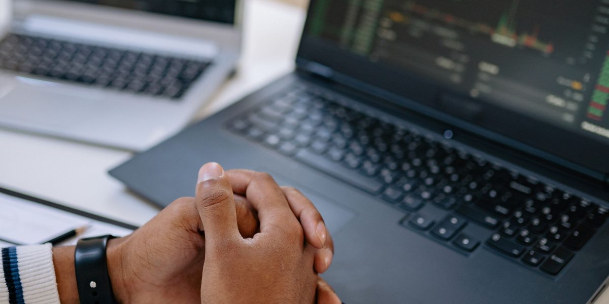 A person intently analyzing data, reflecting the meticulous process of testing and diagnostics in software development.